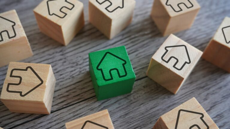 Wooden blocks with house icon.